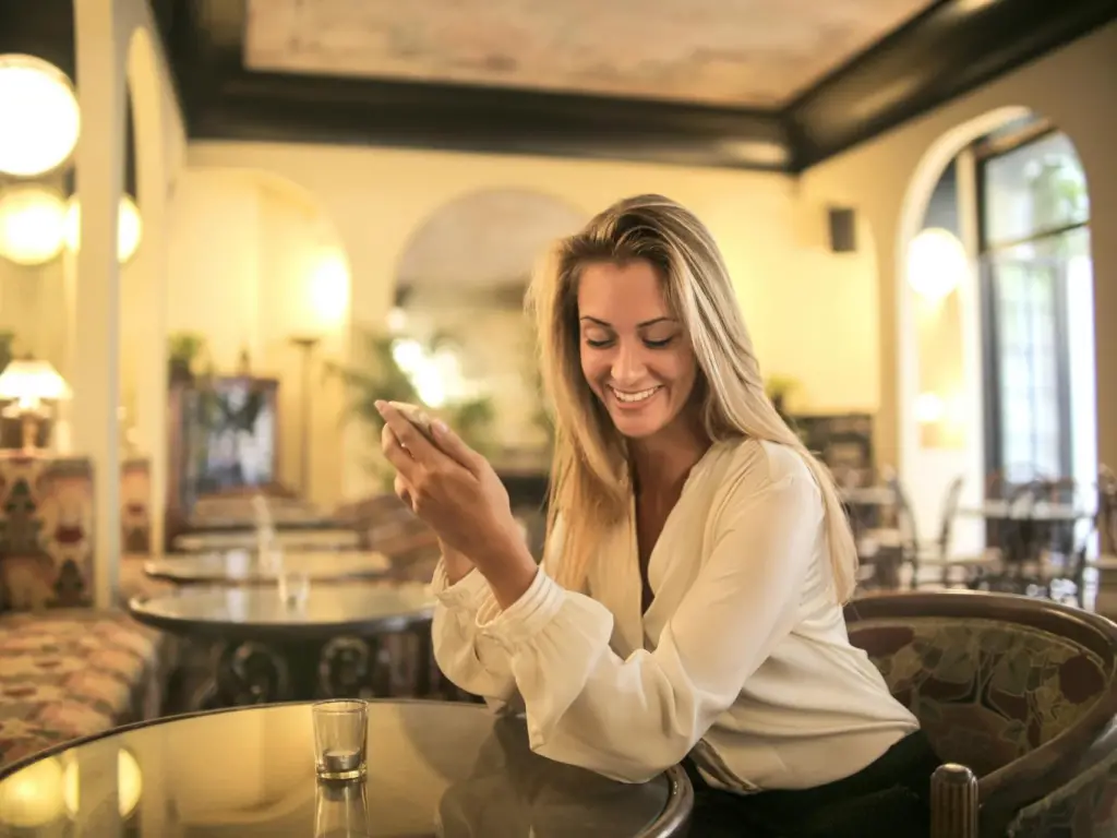 Woman enjoying in hotel with phone